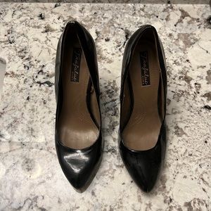 Black patent leather with a hint of peachy pink pump